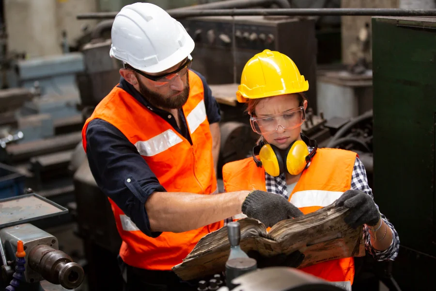 Pre-implementation analysis in manufacturing helps define the right direction for growth
(two employees reviewing an old document)